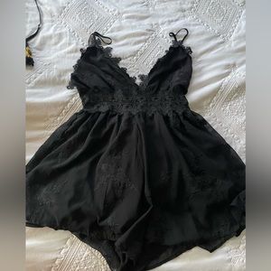 Fashion Nova romper. Lacy for a night out, adjustable straps and zips